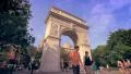 People walk by the famous Washington Square Park Arch in New York City 4k or 4k+ Resolution