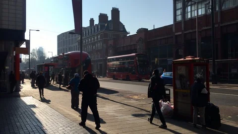 People walk front of an old train station in London morning 스톡 동영상 103838104