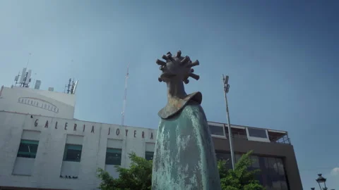 People walk near Alejandro Colunga bronze sculptures at Cabanas museum plaza Stock-Footage 345618111