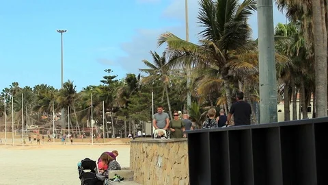 People walk next to beach Stock Footage 85894465