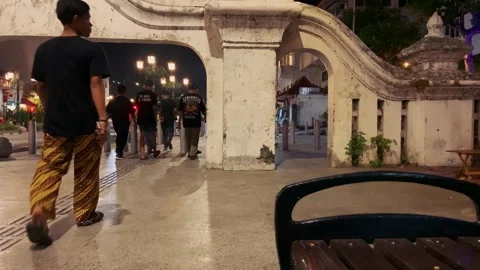 People walk at night in Java Stock Footage 255417751