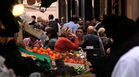 People walk by the old market street in Bologna, Italy. Video stock 59790146