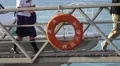 People Walk Off Passenger Ferry Walkway From Boat Dock With Life Preserver 4K 4k or 4k+ Resolution