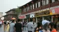 People Walk Passing Nanjing Shopping Street Chinese Restaurant Buyers Shop Store HD Footage