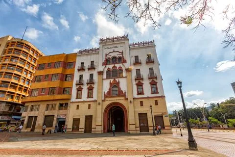 People walk past the facade of the Edificio Coltobaco in downtown Cali, Colombia Stock Photos
