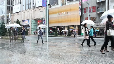 People walk on the rainy streets of Shanghai, China. Stock Footage