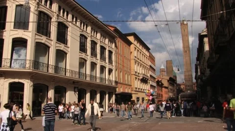 People walk by the street of the city in Bologna, Italy. Stock Footage 59779873