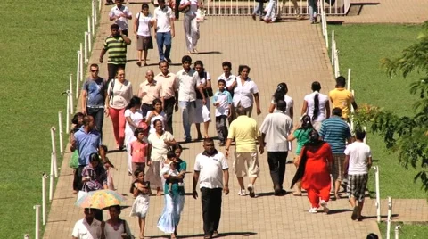 People walk by the territory of the Temple of Tooth in Kandy, Sri Lanka. Video stock 64234053