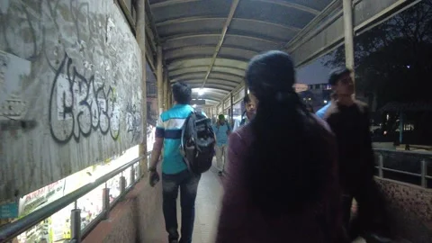 People walk on thane bridge in rush hour. POV. Stock Footage 236120485