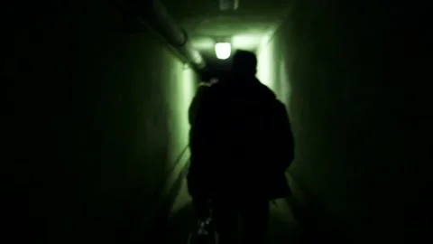 People Walk Through Dark Underground Tunnel at Secret Soviet Military Base Video stock 293745372
