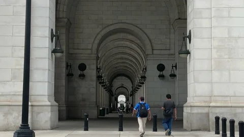 People walk in tunnel outside of Union Station in DC Stock Footage