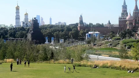People walk in the Zaryadye Park is a landscape park located  in Moscow Stock Footage