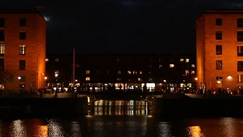 People walking about at The Albert Dock complex on Liverpool Waterfront Stock Footage 70378976