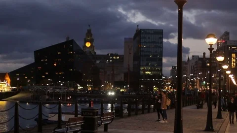 People walking about at The Albert Dock complex on Liverpool Waterfront Stock Footage 70381159