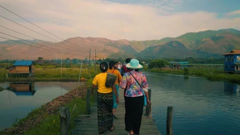 PEOPLE WALKING ACROSS BRIDGE Stock Footage 139096367