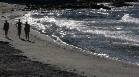 People walking along the beach Stock Footage 41753468