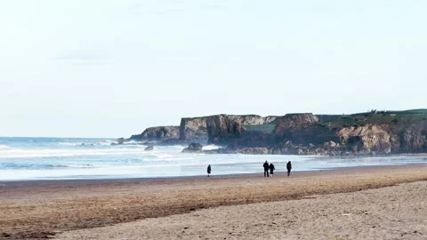 People walking Along the Beach Stock Footage 282794908