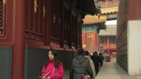 People Walking Along Corridor at Lama Temple in Beijing, China Stock Footage 345829853