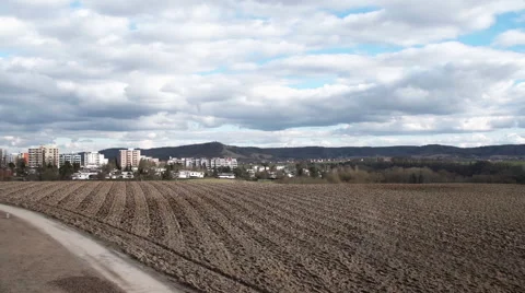 People walking along an empty field with country side background Stock-Footage 65247374