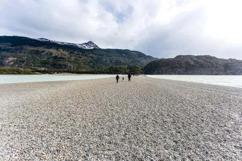 People walking along path during low tide in Glacier Gray, beautiful mountain Stock Photos