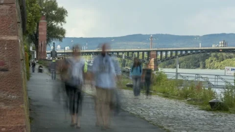 People walking along Path by the River Timelapse 4K /Pedestrian Zone  Stock Footage 132959091