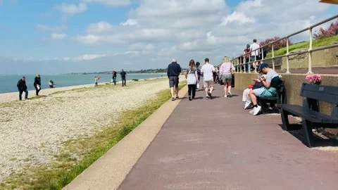 People Walking Along Seafront Path At Lee On Solent In Hampshire England Видео 334827285