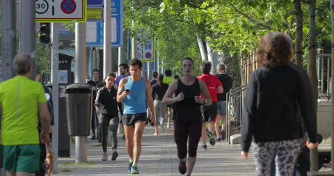 People walking and doing individual sport in Madrid, during COVID-19 pandemic Stock Footage 130334607
