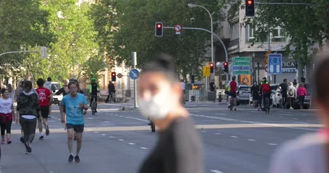People walking and doing individual sport in Madrid, during COVID-19 pandemic Stock Footage 130334753