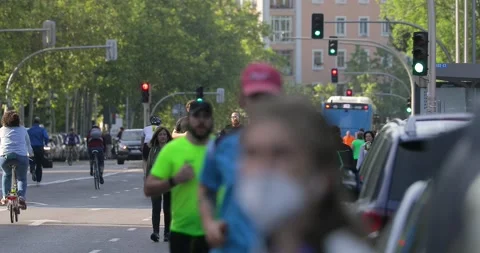 People walking and doing individual sport in Madrid, during COVID-19 pandemic Stock Footage 130334953