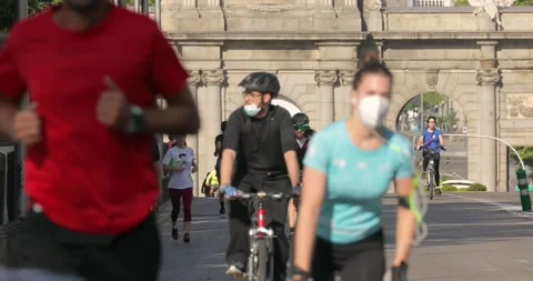 People walking and doing individual sport in Madrid, during COVID-19 pandemic Stock Footage 130335021