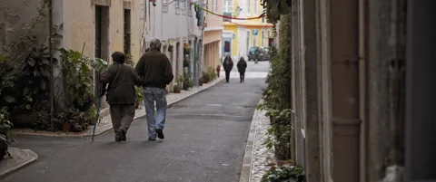 People walking up and down on peaceful lisbon street . Slow motion Stock Footage 145144700