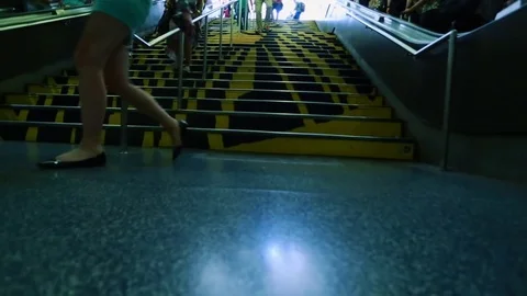 People walking up and down stairs and escalators at subway station Stock Footage 78077578