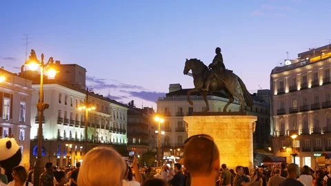  People walking and having fun in Puerta del Sol Square (Sun Gate) at dusk Stock Footage 116386441