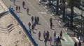 People walking and jogging along Nice seaside beach in morning, healthy life HD Footage