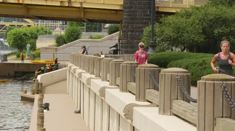 People walking and jogging by river Stock-Footage 40050200
