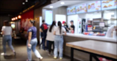 People Walking and Ordering from a Fast Food restaurant. Blurred background 4K Stock Footage 277877177