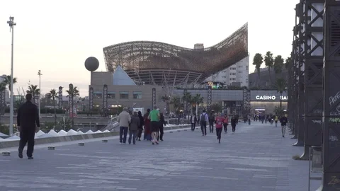 People walking and running on the seafront of Barcelona Stock Footage 98058630