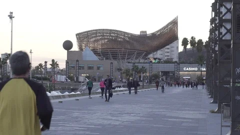 People walking and running on the seafront of Barcelona Video stock 98058670