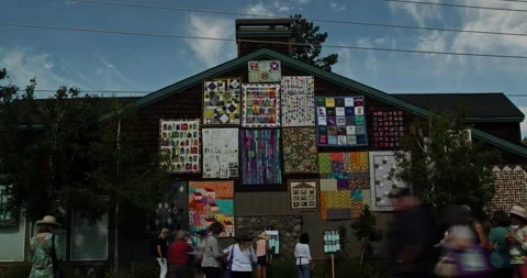 People walking around and looking at quilts during the Sisters Outdoor Quilt Stock Footage 229124215