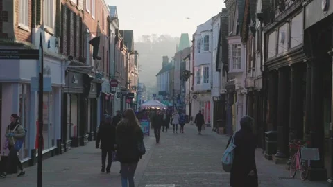 People walking around in Market, High street and town center of Winchester Video stock 244481653