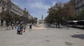 People walking around the woman statue on Aliados Avenue, Porto 4k or 4k+ Resolution