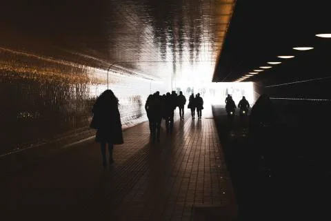 People walking in backlight Stock-Fotos