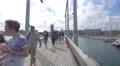 People walking in Barcelona's harbor on Rambla de Mar 4k or 4k+ Resolution