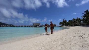 People walking on beach in Bora Bora Stock Footage 85864199