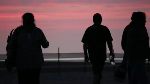 People Walking on Beach in Evening Stock Footage 11442039