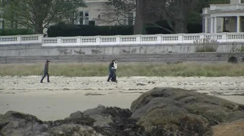 People walking on beach in fall Stock Footage 8911982
