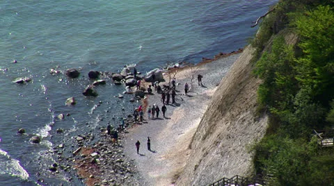 People walking on beach Stock Footage 22605357