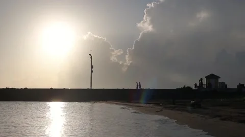 PEOPLE WALKING ON THE BEACH Stock Footage 67641901
