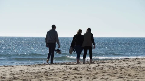People walking on the beach Stock Footage 89693409