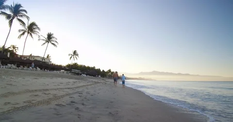 People walking on a beach.  Stock Footage 102689640